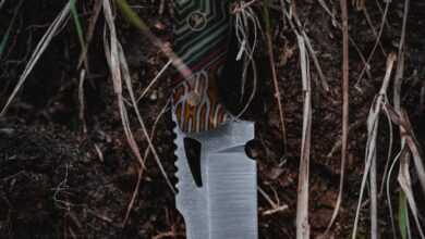 A knife with a camouflage pattern on it