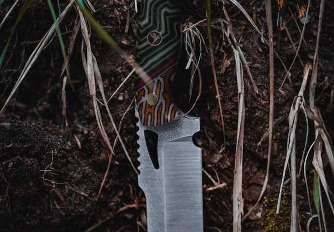 A knife with a camouflage pattern on it