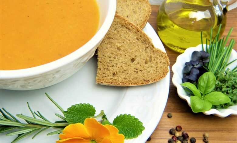 carrot soup, loaf, herbs