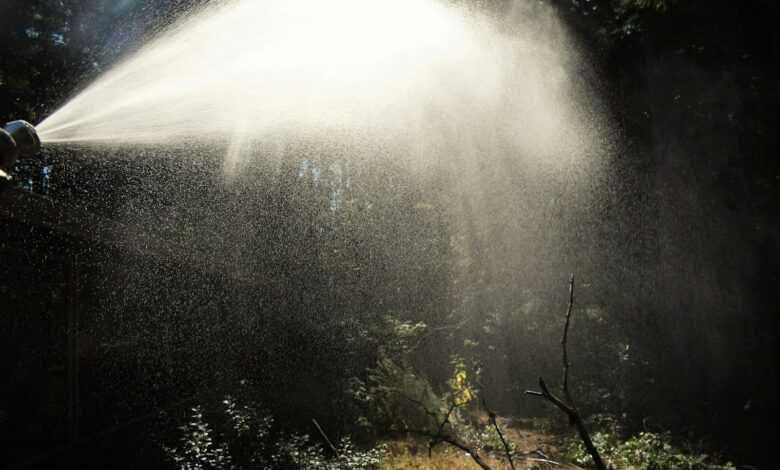 a fire hydrant spewing water into the air