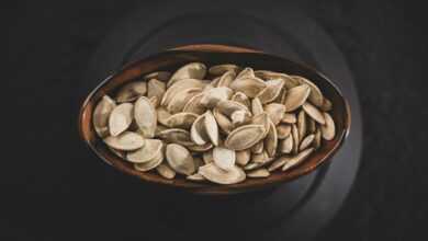 brown and white nuts on brown ceramic bowl