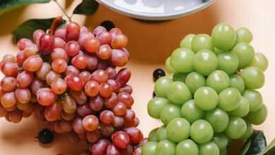 Delicious fresh grapes on table