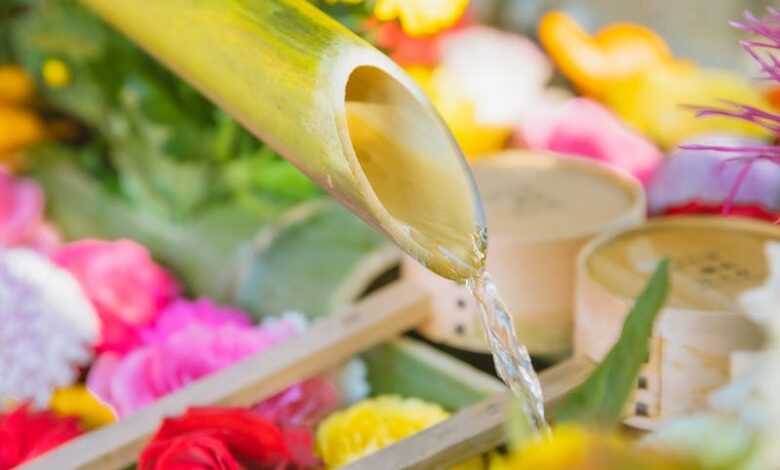 Floral decorations with bamboo fountain in garden