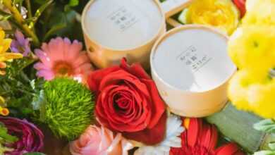 Japanese water basin with bamboo pipe and ladles decorated with colourful fresh flowers