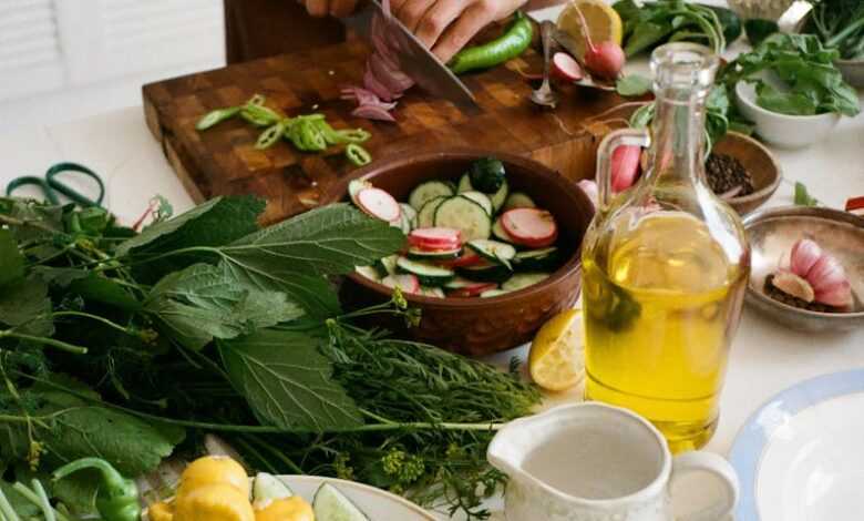 Person Slicing Vegetables on Chopping Board