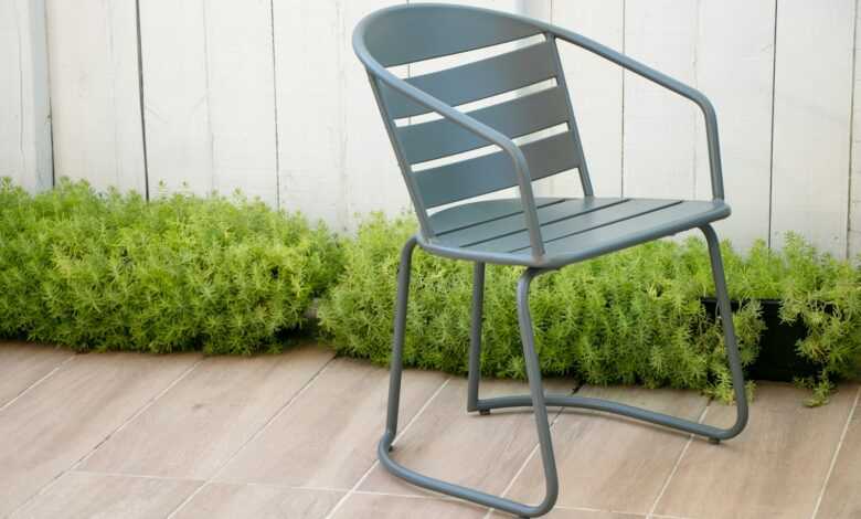 gray plastic armchair on green grass