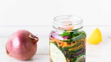 clear glass bottle on white table