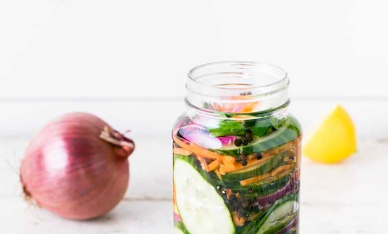 clear glass bottle on white table