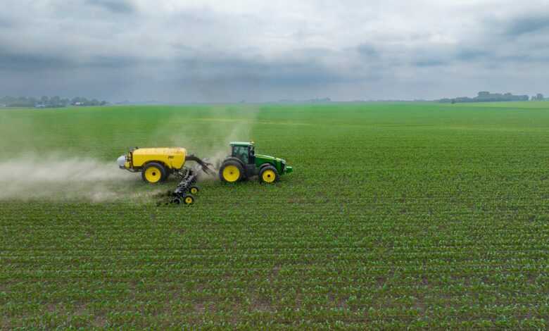 a few farm machines in a field