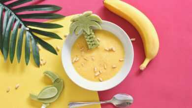 oatmeal on white bowl beside yellow banana