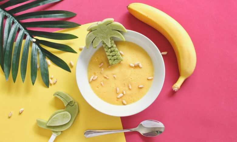 oatmeal on white bowl beside yellow banana