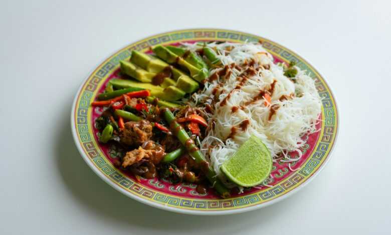 white and red ceramic bowl with food