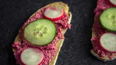 bread with sliced dragon fruit and cucumber on top