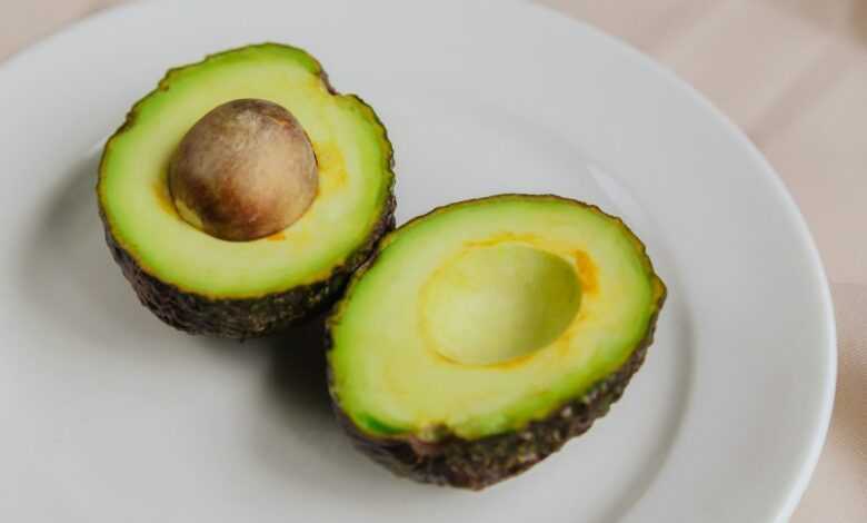 sliced avocado fruit on white ceramic plate