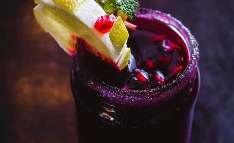 purple drink with straw and lemon slice