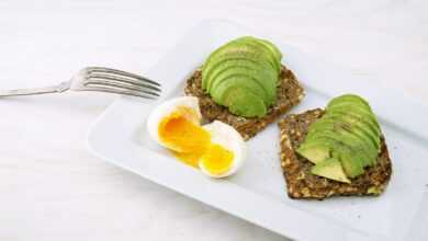 rectangular white platter of sliced food and eggs