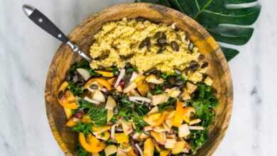 cooked rice with vegetable salad in brown wooden bowl