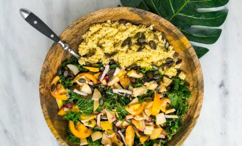 cooked rice with vegetable salad in brown wooden bowl