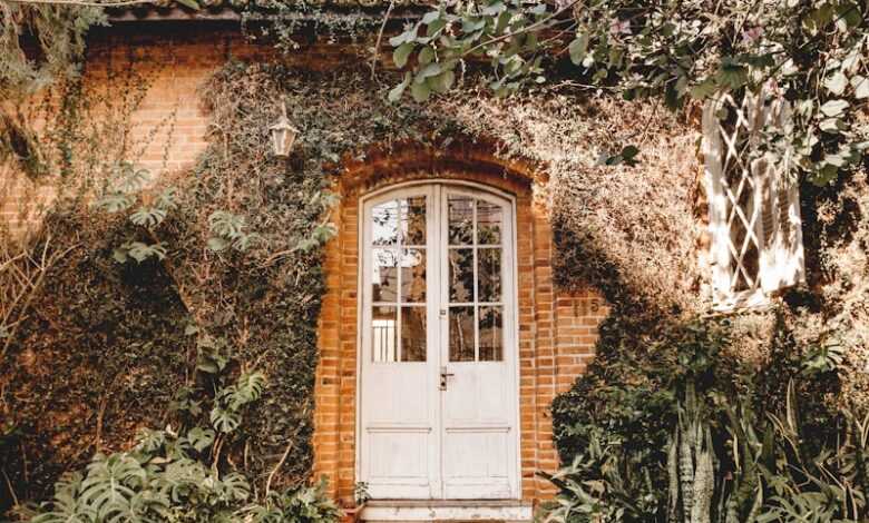 brown brick house with green plants