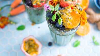 tilt shift lens photography of fruits in drinking glass