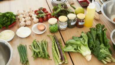 green vegetable on brown wooden table