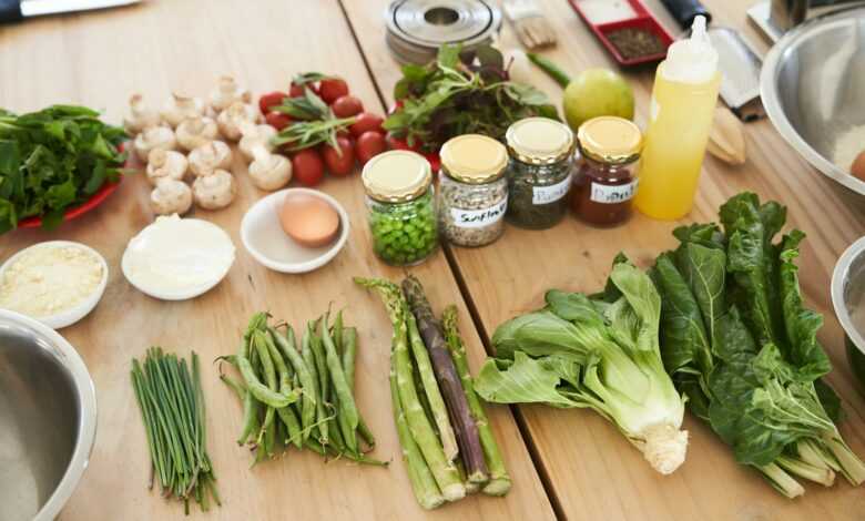 green vegetable on brown wooden table