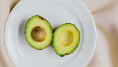 sliced avocado fruit on white ceramic plate