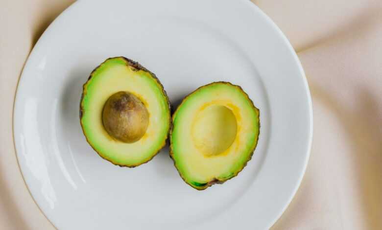 sliced avocado fruit on white ceramic plate