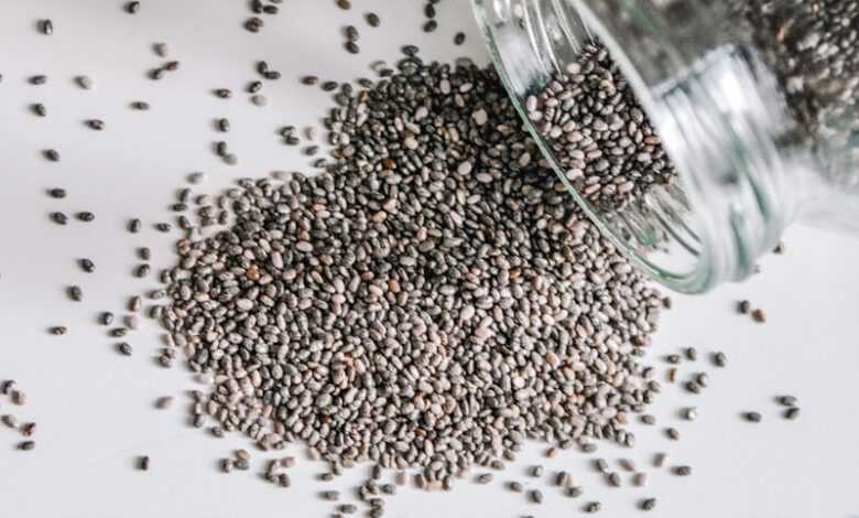 black beads in clear glass jar