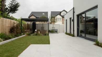 a house with a large yard and a covered patio