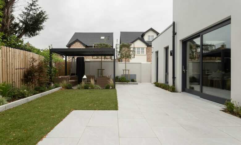 a house with a large yard and a covered patio