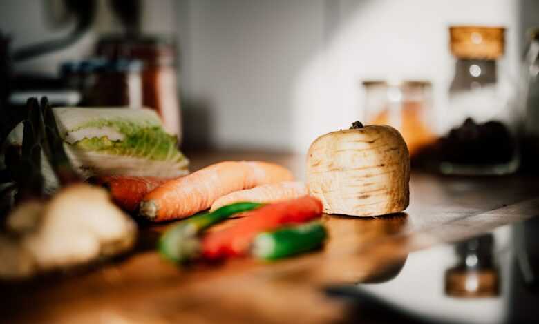 sliced vegetables on brown wooden chopping board