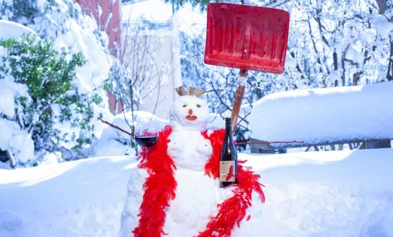 a snowman with a red lantern