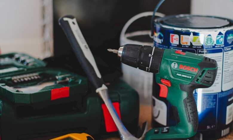 red and black cordless power drill beside black and red cordless power drill